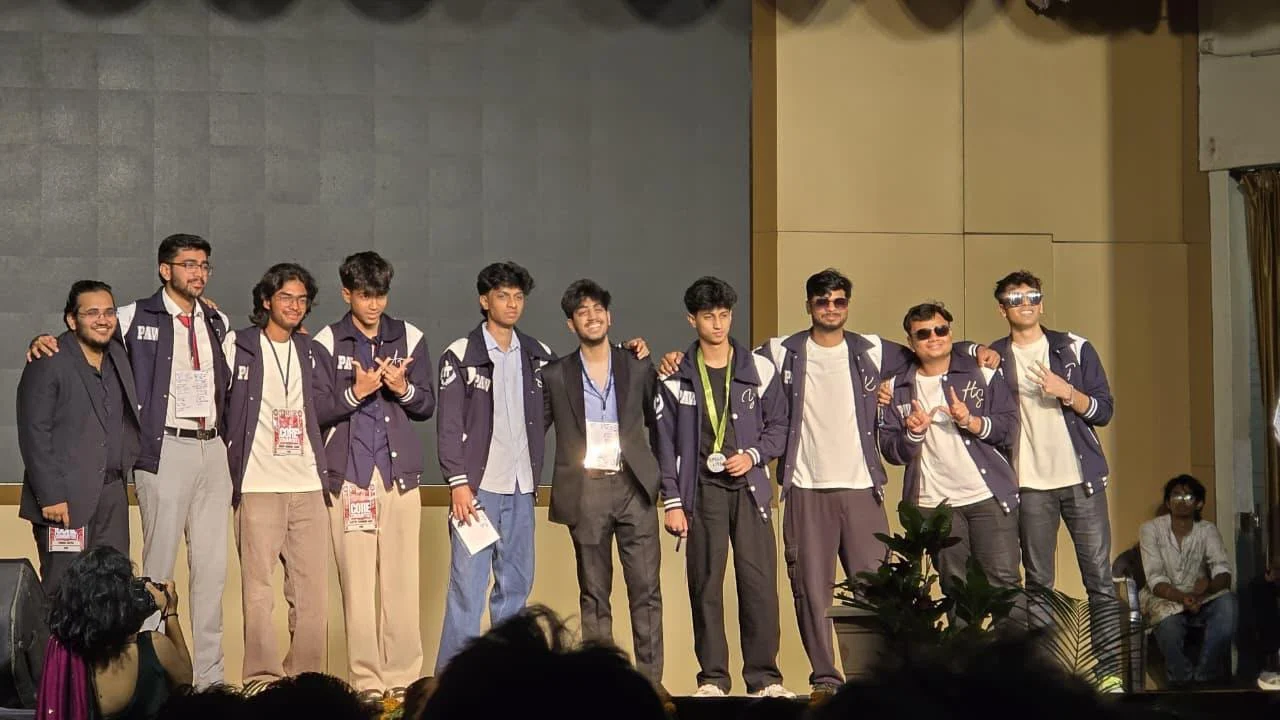 Students wearing matching varsity jackets at an event